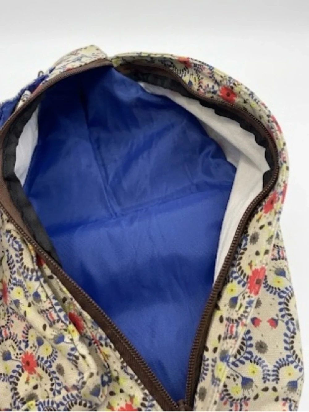 Kavu Cream Floral Rope Sling Backpack with Coral Accents